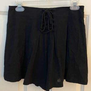 Black shorts with bow in front.